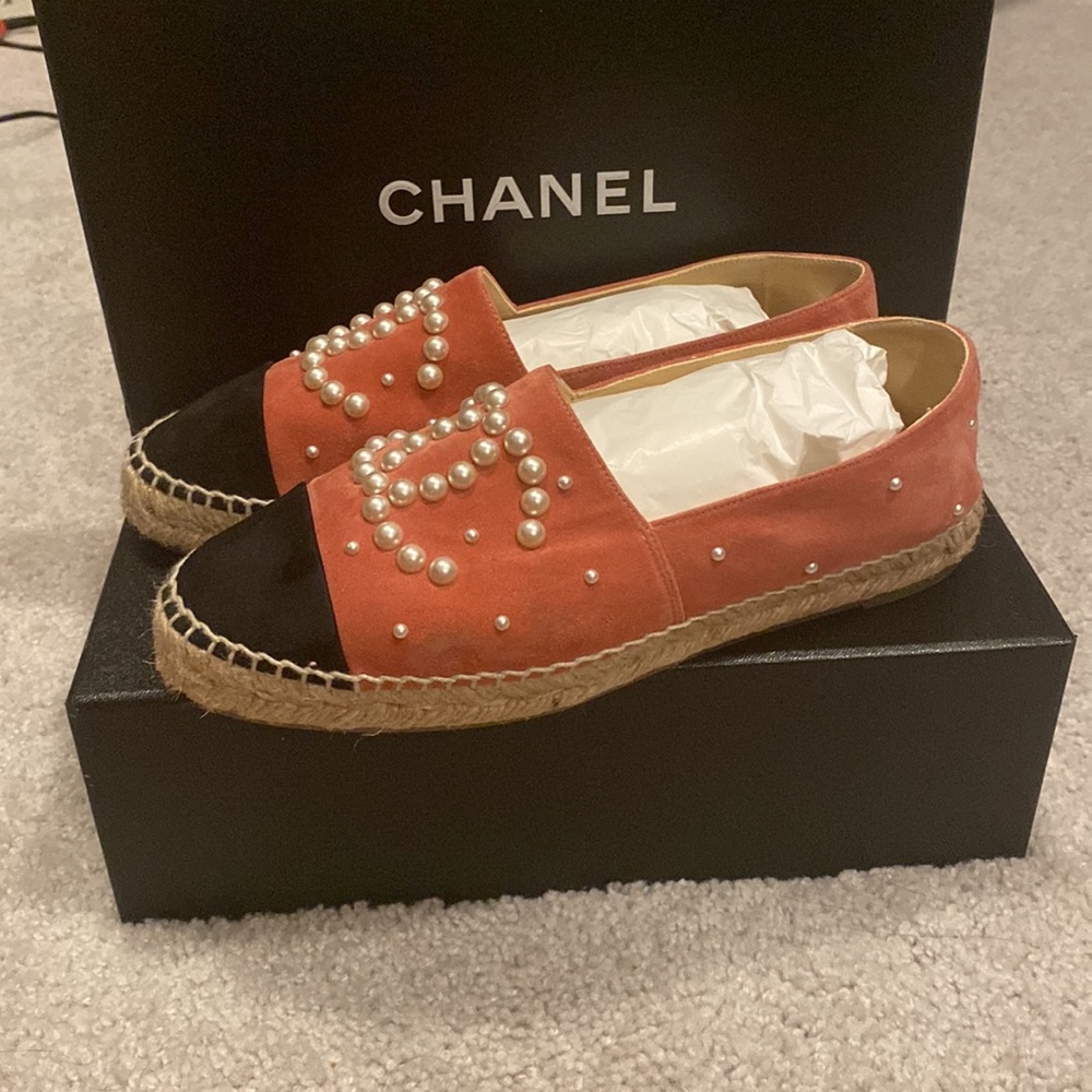 Chanel pink pearls espadrilles.